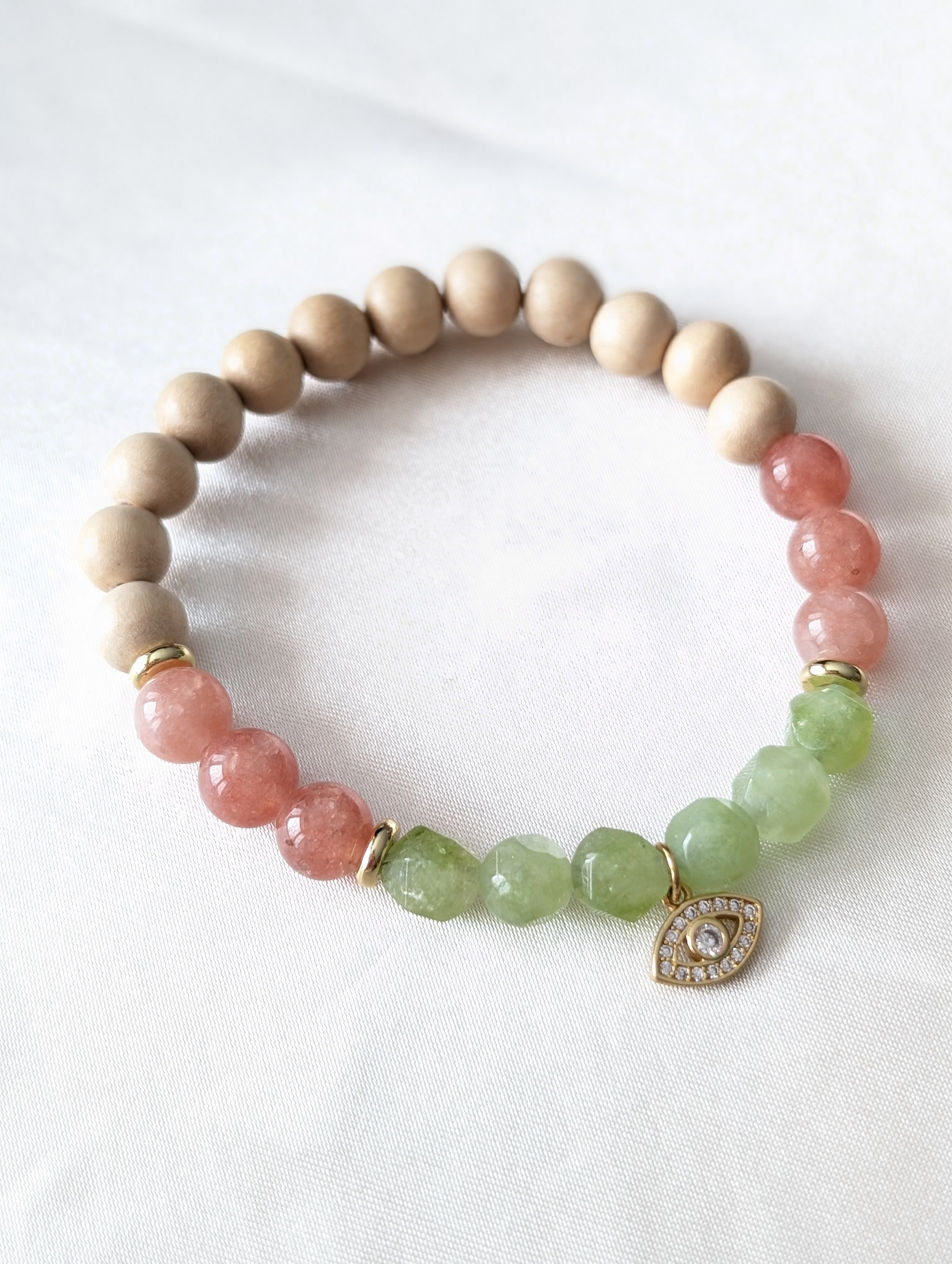 Peach Moonstone, Green Jade, White Wood Aromatherapy & Gold Evil Eye Charm