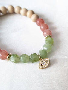 Peach Moonstone, Green Jade, White Wood Aromatherapy & Gold Evil Eye Charm